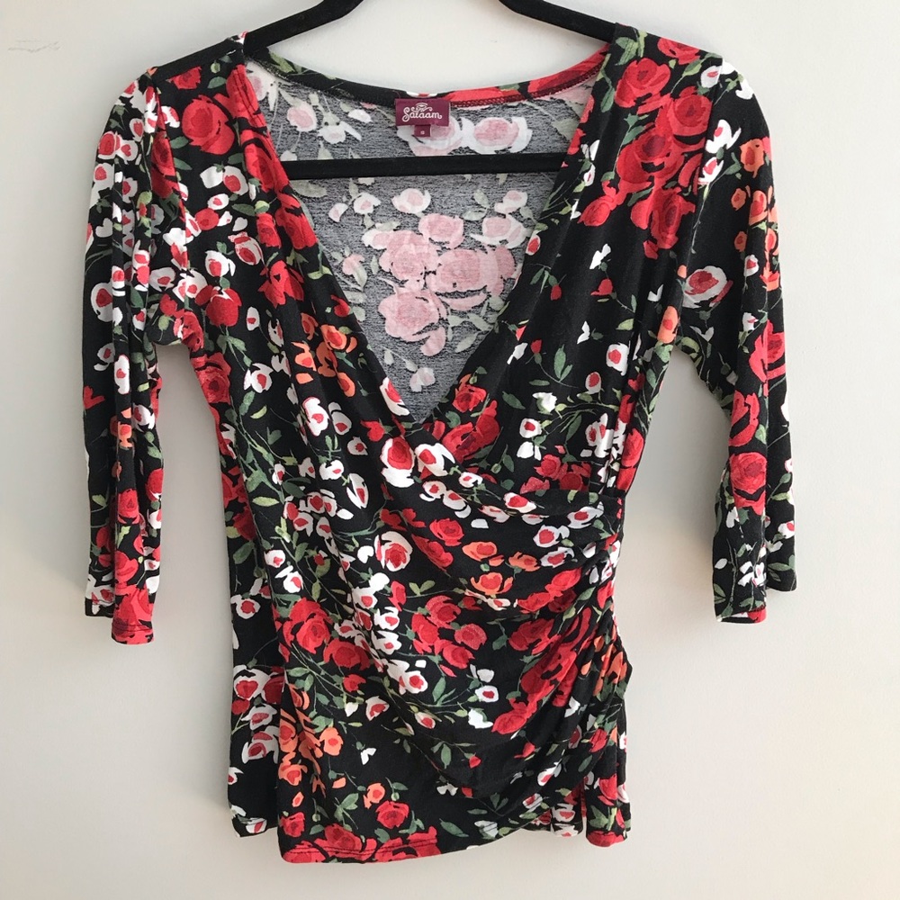 Salaam brand faux wrap shirt with floral print.